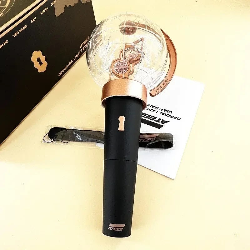 Lightstick Shop ATEEZ Ver.1 lightstick with a black handle, globe top, and gold accents for ATINY concert fans.