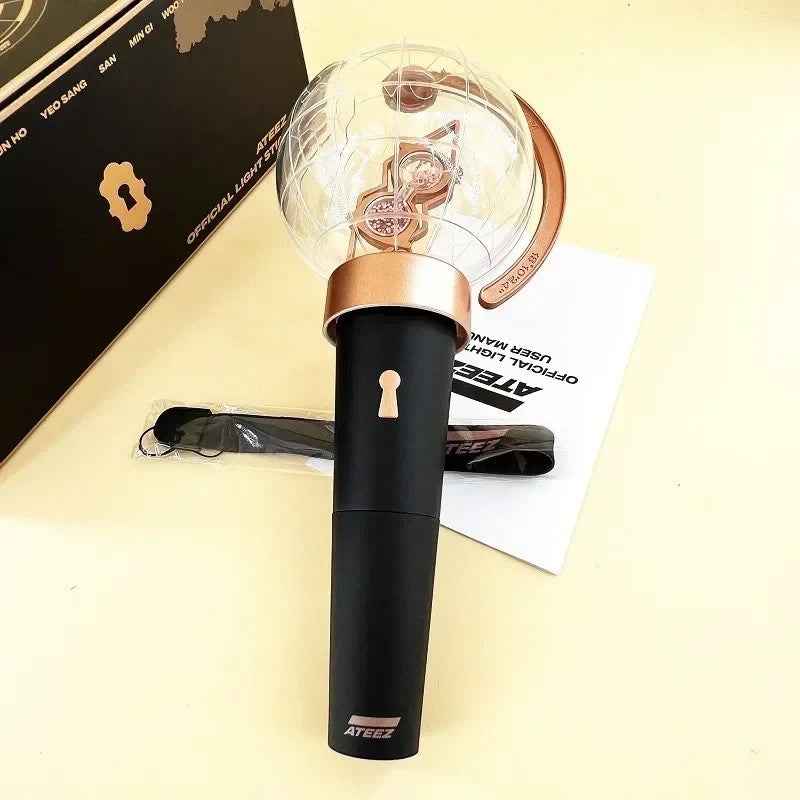 Lightstick Shop ATEEZ Ver.1 lightstick with a black handle, globe top, and gold accents for ATINY concert fans.