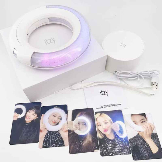 Lightstick Shop official ITZY light ring with white base, charging cable, and five member photo cards