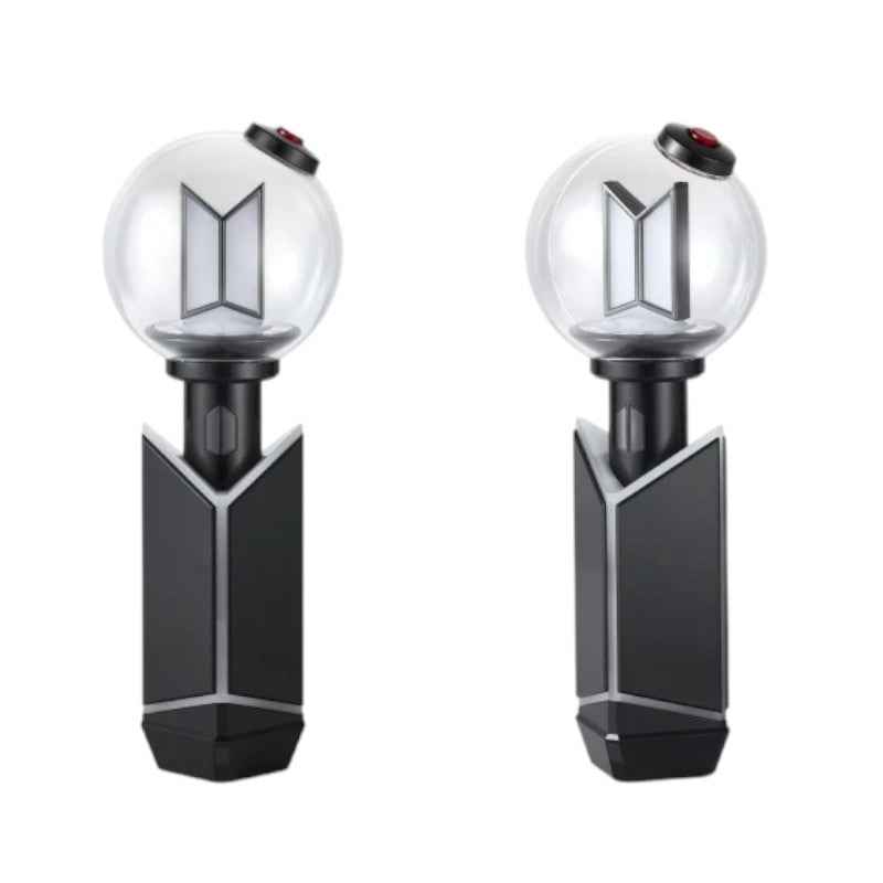 Lightstick Shop BTS ARMY Bomb Ver.4 black ABS charging cradle holding an official lightstick on a white background.