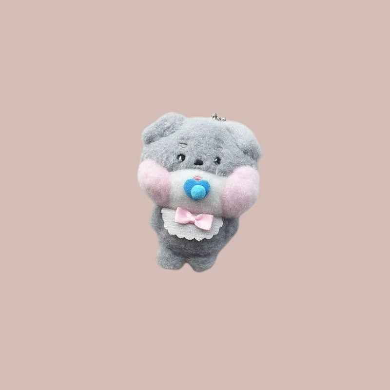 Lightstick Shop Zeroni plush mascot doll, gray, with pink cheeks, blue pacifier, and pink bow bib.