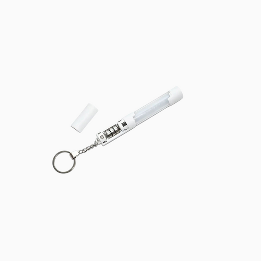 CORTIS Official Mini Lightstick Keyring - White, opened to show the button-cell battery compartment