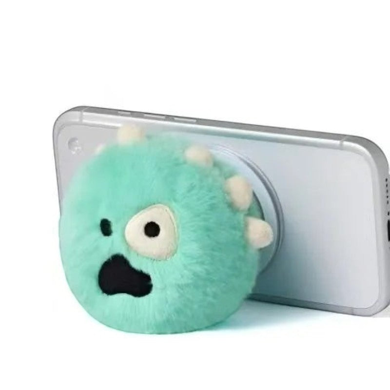 CORTIS Ball griptok fluffy mint green with a cartoon monster face, close-up