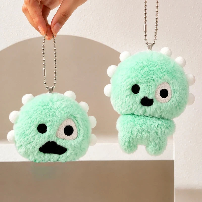 Green plush ball keychains with cartoon faces for backpacks and bags