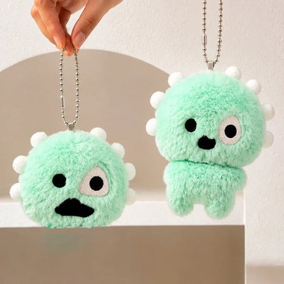 Green plush ball keychains with cartoon faces for backpacks and bags