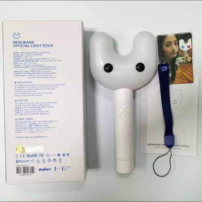 Lightstick Shop NewJeans Binky Bong rabbit-shaped lightstick with wrist strap, photocards, and original packaging box.