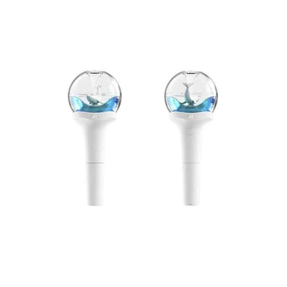 Lightstick Shop official NMIXX lightstick featuring a white handle and a clear globe with a blue whale figurine inside.