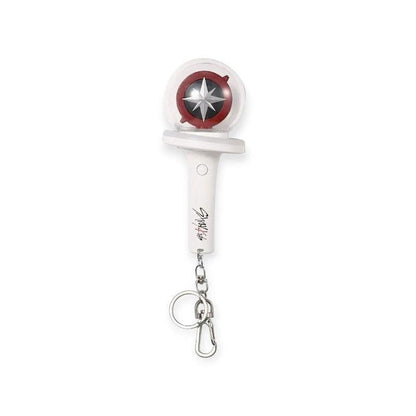 Lightstick Shop Stray Kids mini lightstick keychain with a starburst design and red accents, includes batteries.