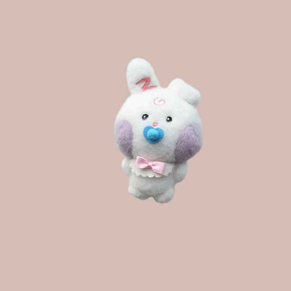 Lightstick Shop Zeroni plush mascot doll, a white bunny with purple cheeks, a blue pacifier, and a pink bow.