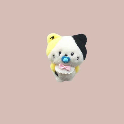 Lightstick Shop Zeroni plush mascot doll with yellow, white, and black fur, wearing a blue pacifier and pink bow bib.
