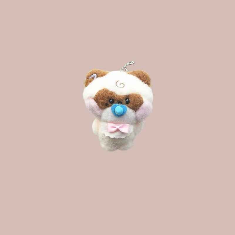 Lightstick Shop Zeroni plush mascot doll, a tan and white animal with brown markings, blue pacifier, and pink bow.